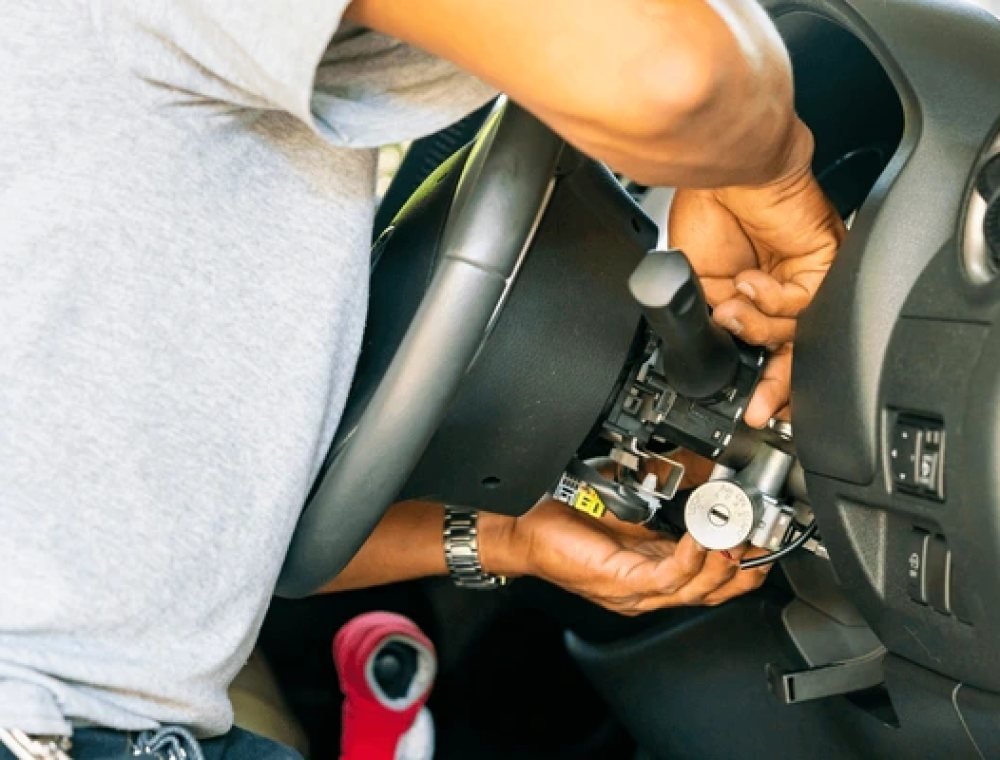 Locksmith repairing a car ignition